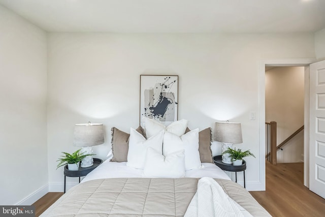 bedroom featuring wood-type flooring