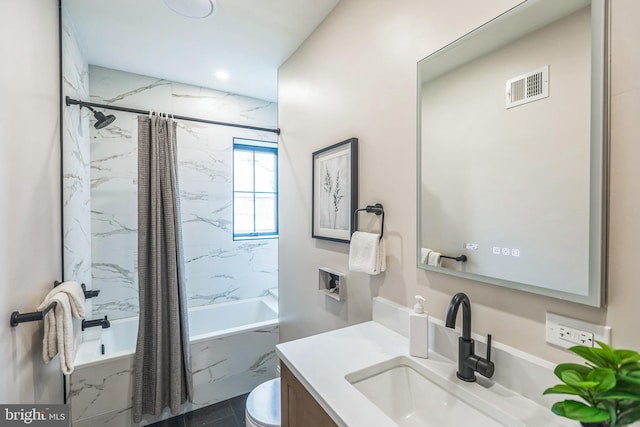 full bathroom with vanity, toilet, and shower / bath combo