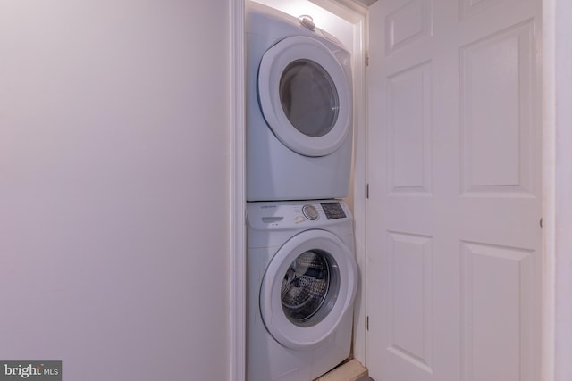 laundry room featuring stacked washing maching and dryer