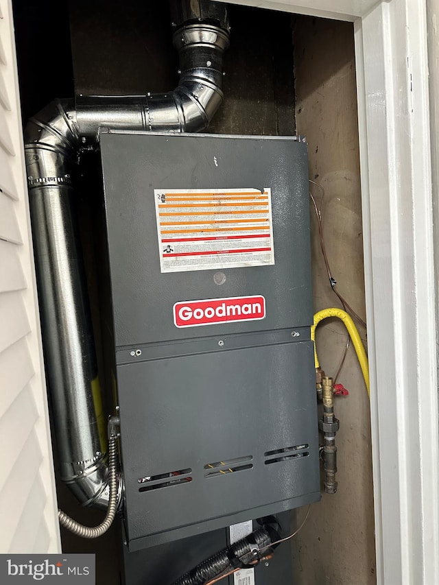 utility room featuring heating unit