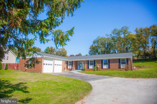 single story home featuring a front lawn and a garage