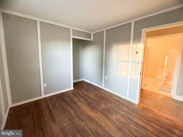 empty room with hardwood / wood-style flooring