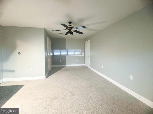 unfurnished bedroom with carpet floors and ceiling fan