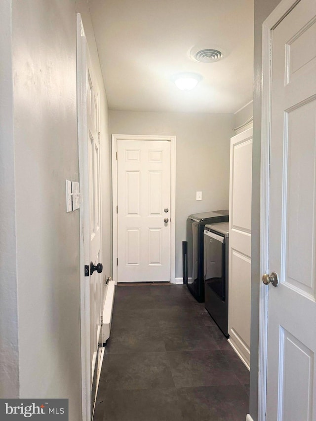 clothes washing area featuring washing machine and dryer