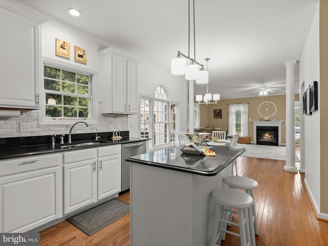 211 Glyndon Meadow Rd, Reisterstown, MD 21136 - kitchen featuring stainless steel dishwasher, a sink, dark countertops, open floor plan, and recessed lighting