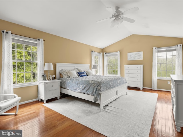 211 Glyndon Meadow Rd, Reisterstown, MD 21136 - bedroom with light wood finished floors, lofted ceiling, baseboards, and a ceiling fan