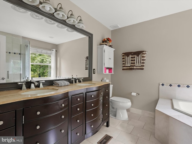 211 Glyndon Meadow Rd, Reisterstown, MD 21136 - full bathroom featuring tile patterned floors, double vanity, a bath, toilet, and a stall shower
