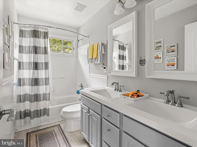 211 Glyndon Meadow Rd, Reisterstown, MD 21136 - full bath featuring toilet, double vanity, and shower / tub combo