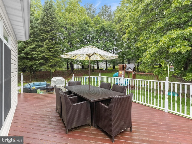 211 Glyndon Meadow Rd, Reisterstown, MD 21136 - wooden terrace featuring a playground, outdoor dining space, view of scattered trees, and outdoor lounge area