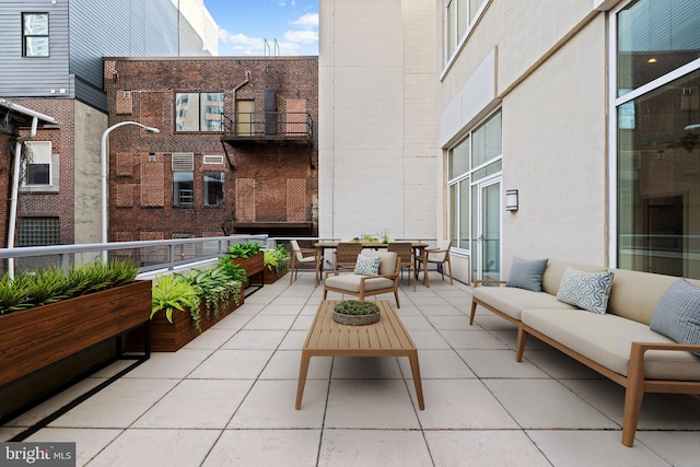 view of patio / terrace with a balcony and outdoor lounge area