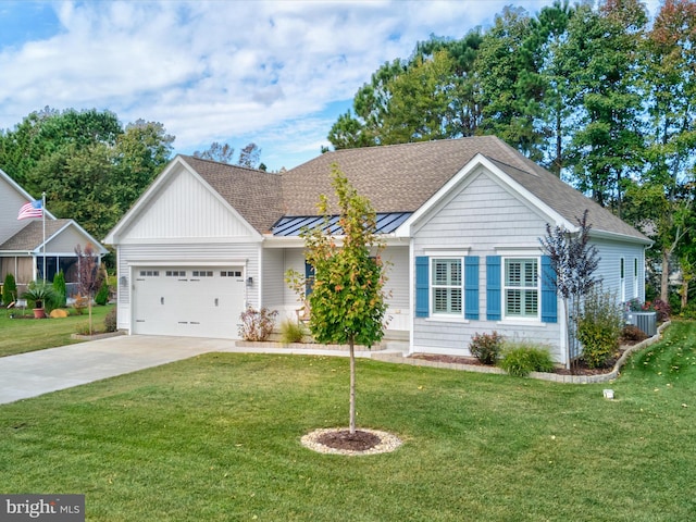 single story home with a front lawn, central AC unit, and a garage