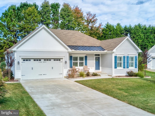 ranch-style house with a garage, covered porch, and a front lawn