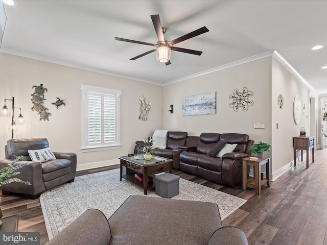 living room featuring ornamental molding, ceiling fan, and dark wood-type flooring