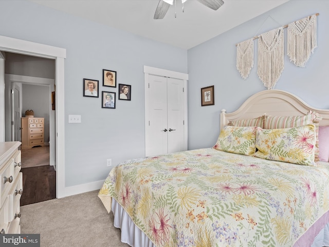 carpeted bedroom featuring a closet and ceiling fan