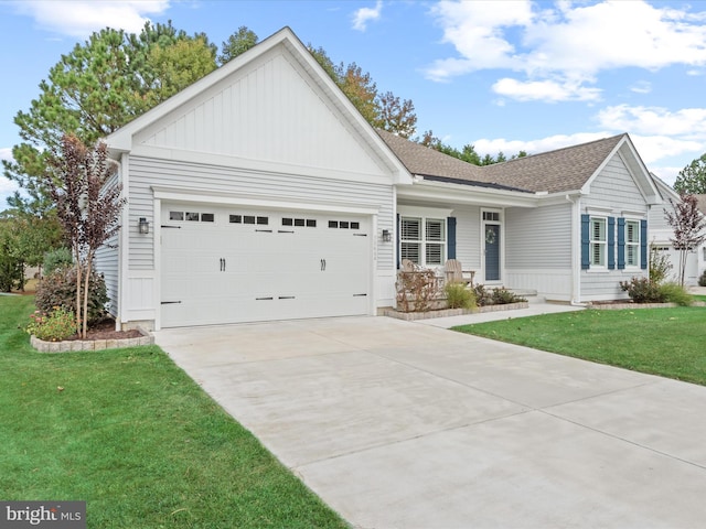 view of front of home with a garage and a front lawn