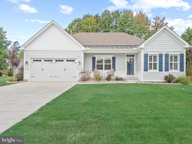 view of front of home featuring a porch, a garage, and a front yard