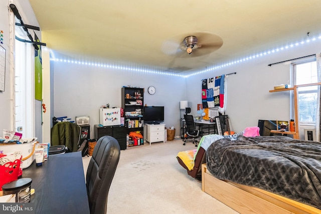 carpeted bedroom with a ceiling fan