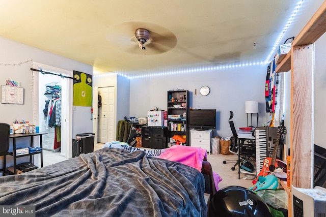 bedroom with ceiling fan and carpet floors