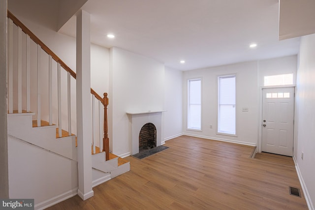 unfurnished living room featuring light hardwood / wood-style floors