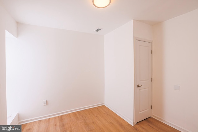 unfurnished room with light hardwood / wood-style floors