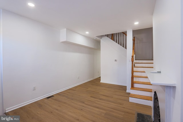 basement featuring wood-type flooring