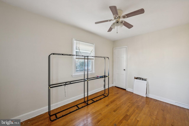 unfurnished bedroom featuring wood-type flooring and ceiling fan