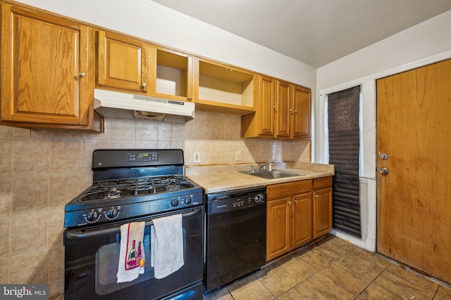 kitchen with light tile patterned flooring, black appliances, sink, and decorative backsplash