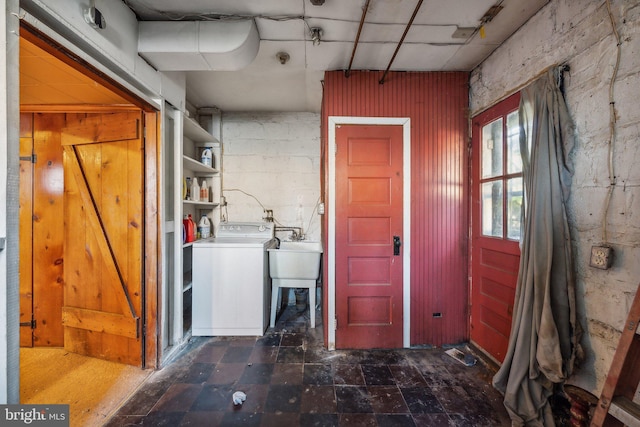 laundry room featuring washer / clothes dryer and sink