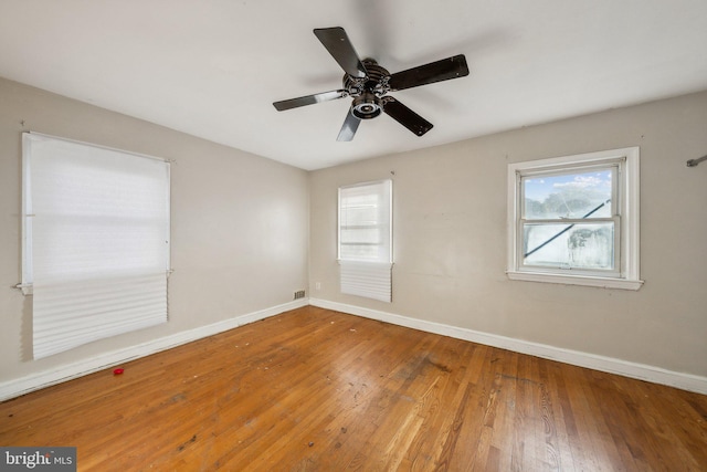 spare room featuring ceiling fan and hardwood / wood-style floors