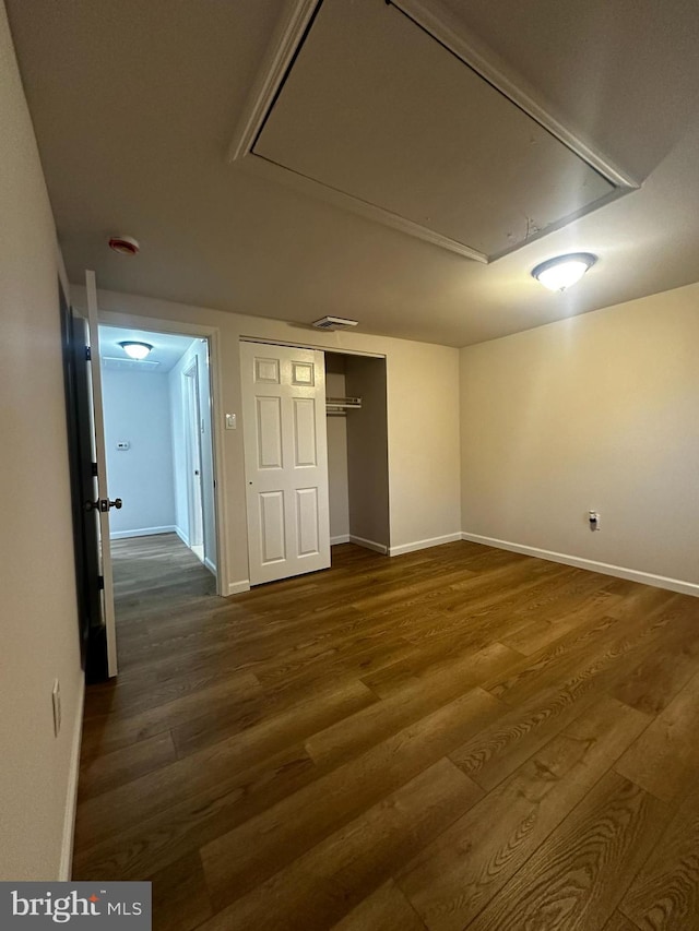 interior space with dark hardwood / wood-style flooring