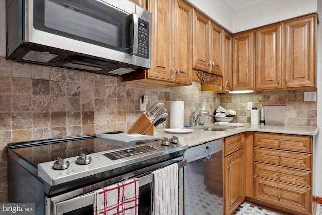 kitchen with backsplash, sink, and stainless steel appliances