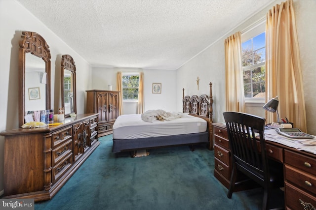 carpeted bedroom with a textured ceiling