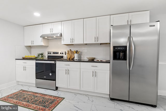 kitchen with decorative backsplash, white cabinets, and stainless steel appliances