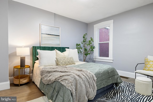 bedroom featuring wood-type flooring