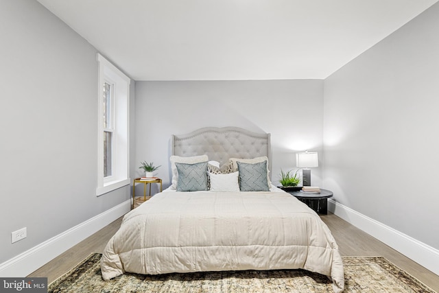 bedroom with hardwood / wood-style flooring