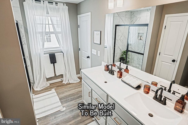 bathroom featuring vanity, hardwood / wood-style flooring, and an enclosed shower