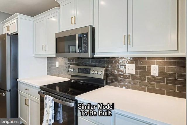 kitchen with backsplash, stainless steel appliances, and white cabinets