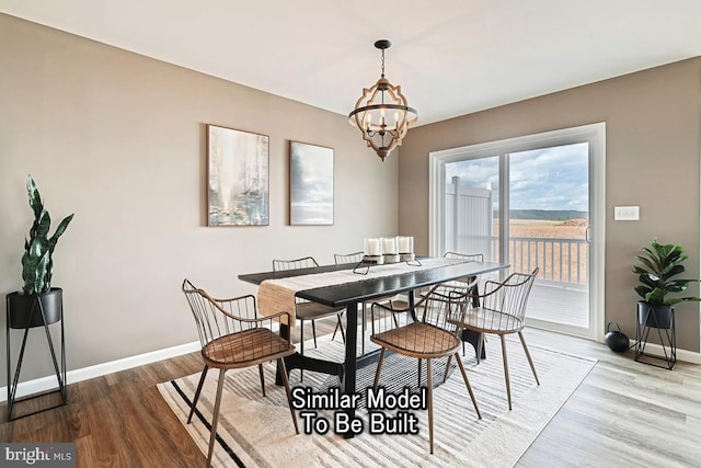 dining area with an inviting chandelier and wood-type flooring