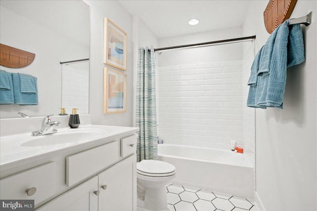 full bathroom featuring vanity, shower / bath combo with shower curtain, and toilet