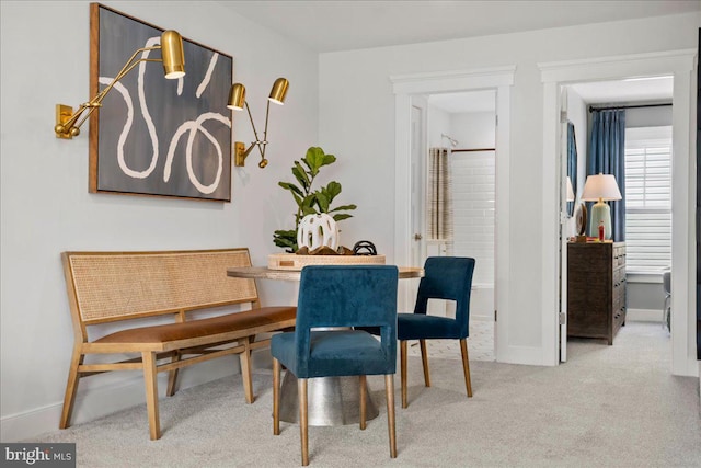 view of carpeted dining space