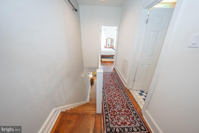 corridor featuring wood-type flooring