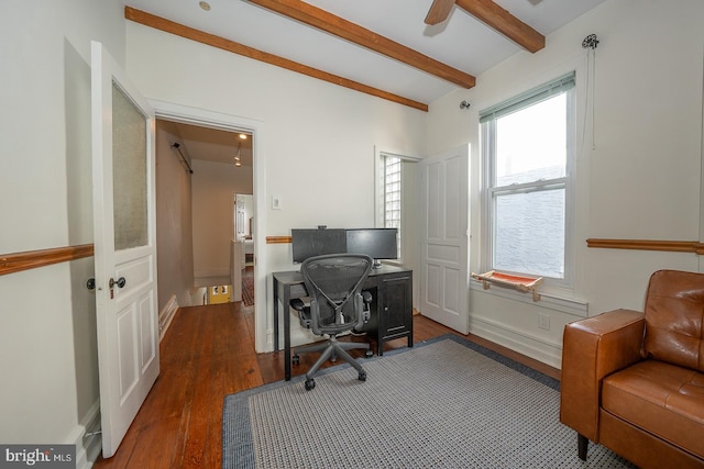 office space with beam ceiling and dark hardwood / wood-style flooring