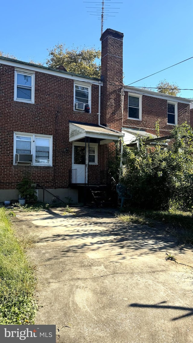 view of front of home with cooling unit