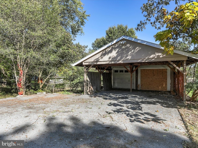 garage featuring a carport