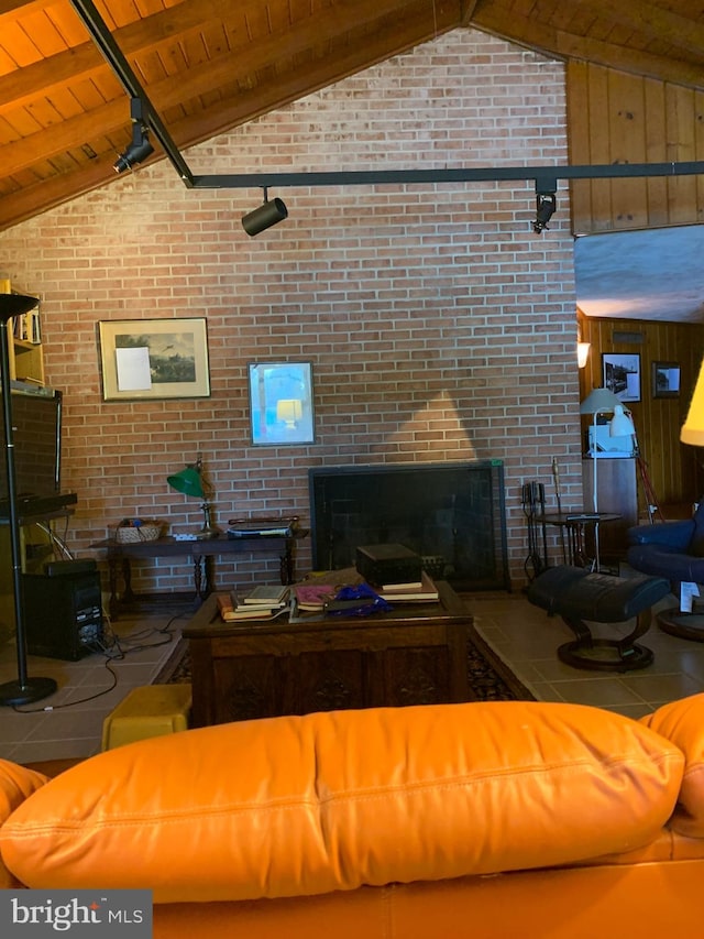 unfurnished living room featuring wooden ceiling, wooden walls, lofted ceiling with beams, and brick wall