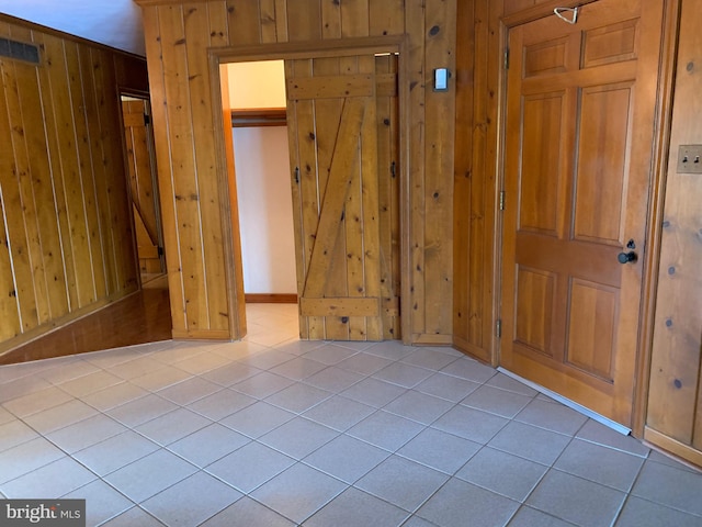 tiled spare room with wooden walls