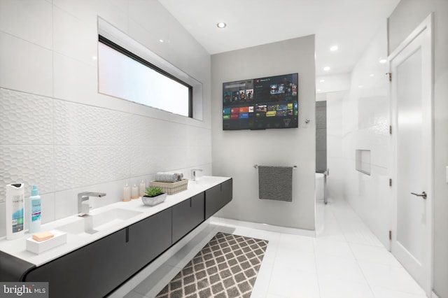 bathroom with tile patterned flooring and vanity