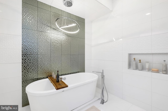 bathroom with tile patterned floors, separate shower and tub, and tile walls