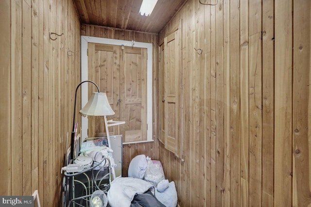 miscellaneous room featuring wooden walls and wooden ceiling