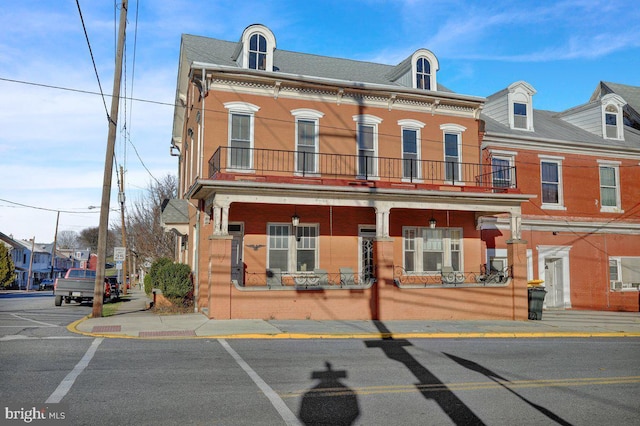 161 W High St, Womelsdorf, PA 19567 - townhome / multi-family property featuring a balcony and covered porch